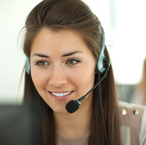 Female customer support operator with headset and smiling